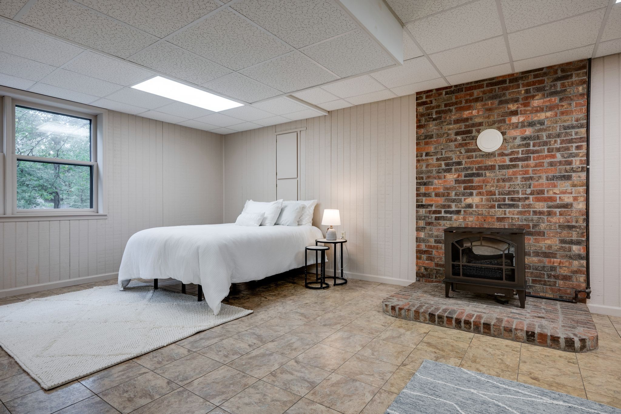 1085 Claylick Road White Bluff, TN 37187 - Photo 19 of 48 a bedroom with a bed and a fireplace