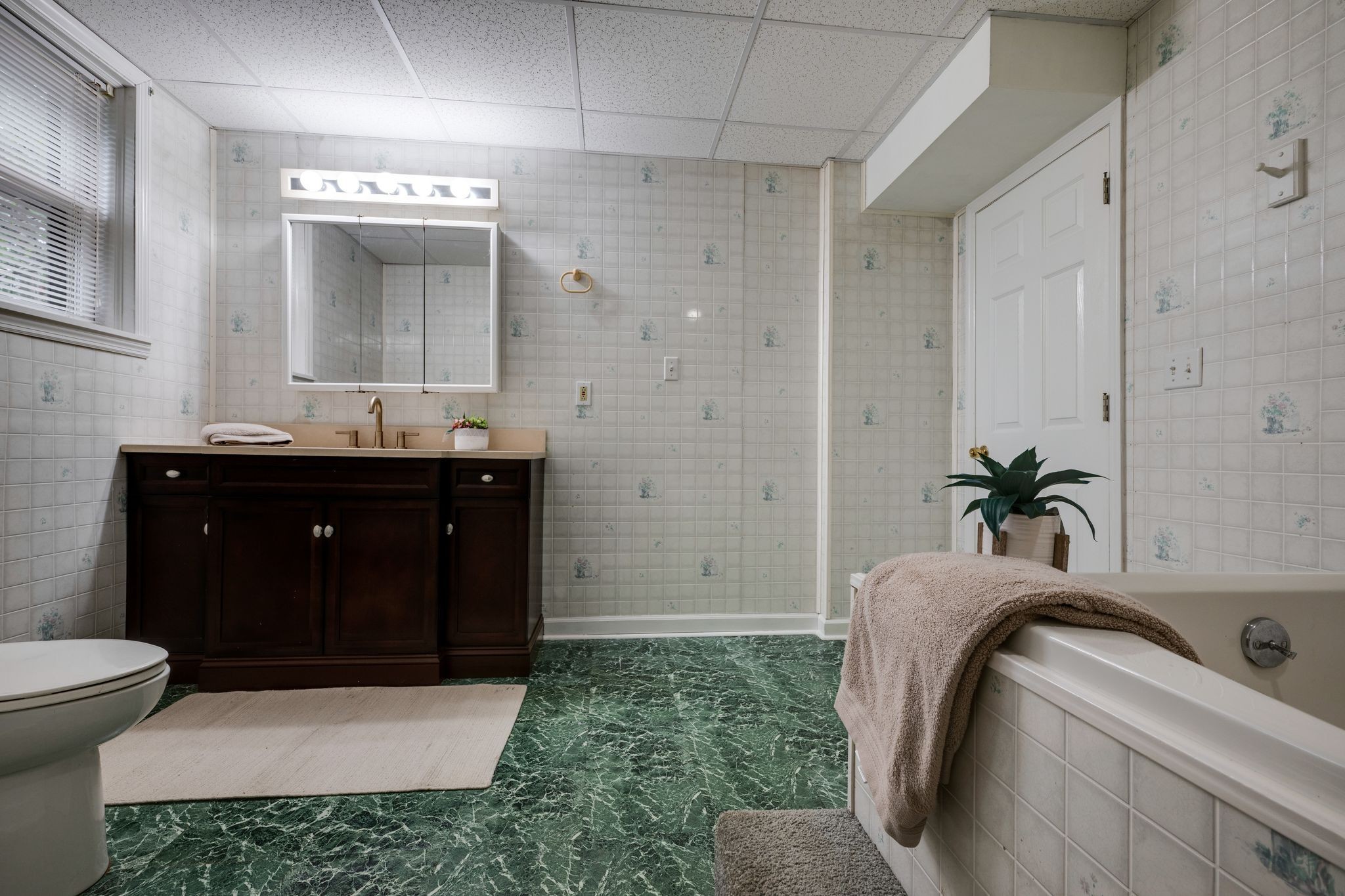 1085 Claylick Road White Bluff, TN 37187 - Photo 21 of 48 a bathroom with a sink and mirror with bathtub