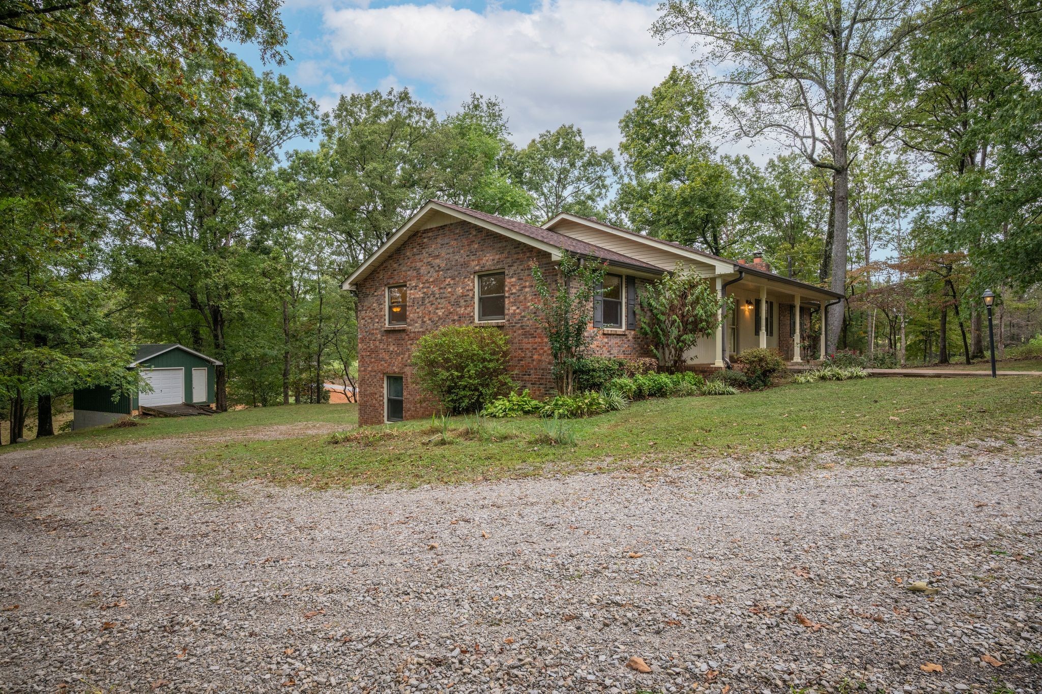 1085 Claylick Road White Bluff, TN 37187 - Photo 42 of 48 a view of a house with a yard and large trees