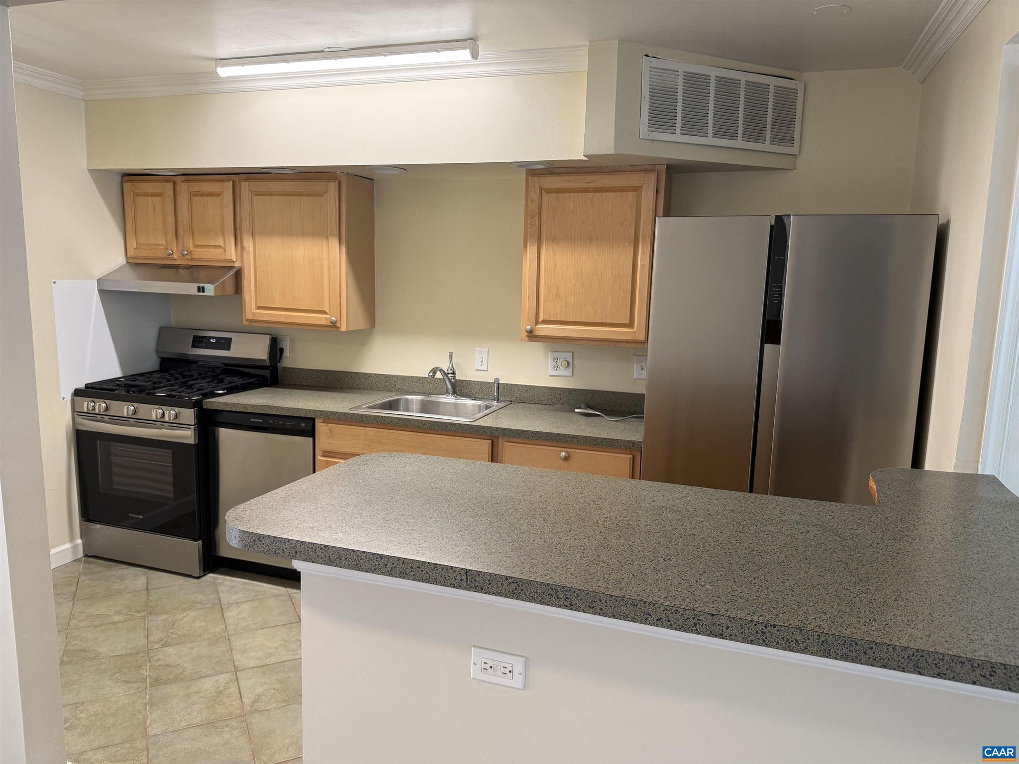 111 Hessian Hills Ridge, Unit 2 Charlottesville, VA 22901 - Photo 3 of 12 a kitchen with granite countertop a refrigerator stove and sink