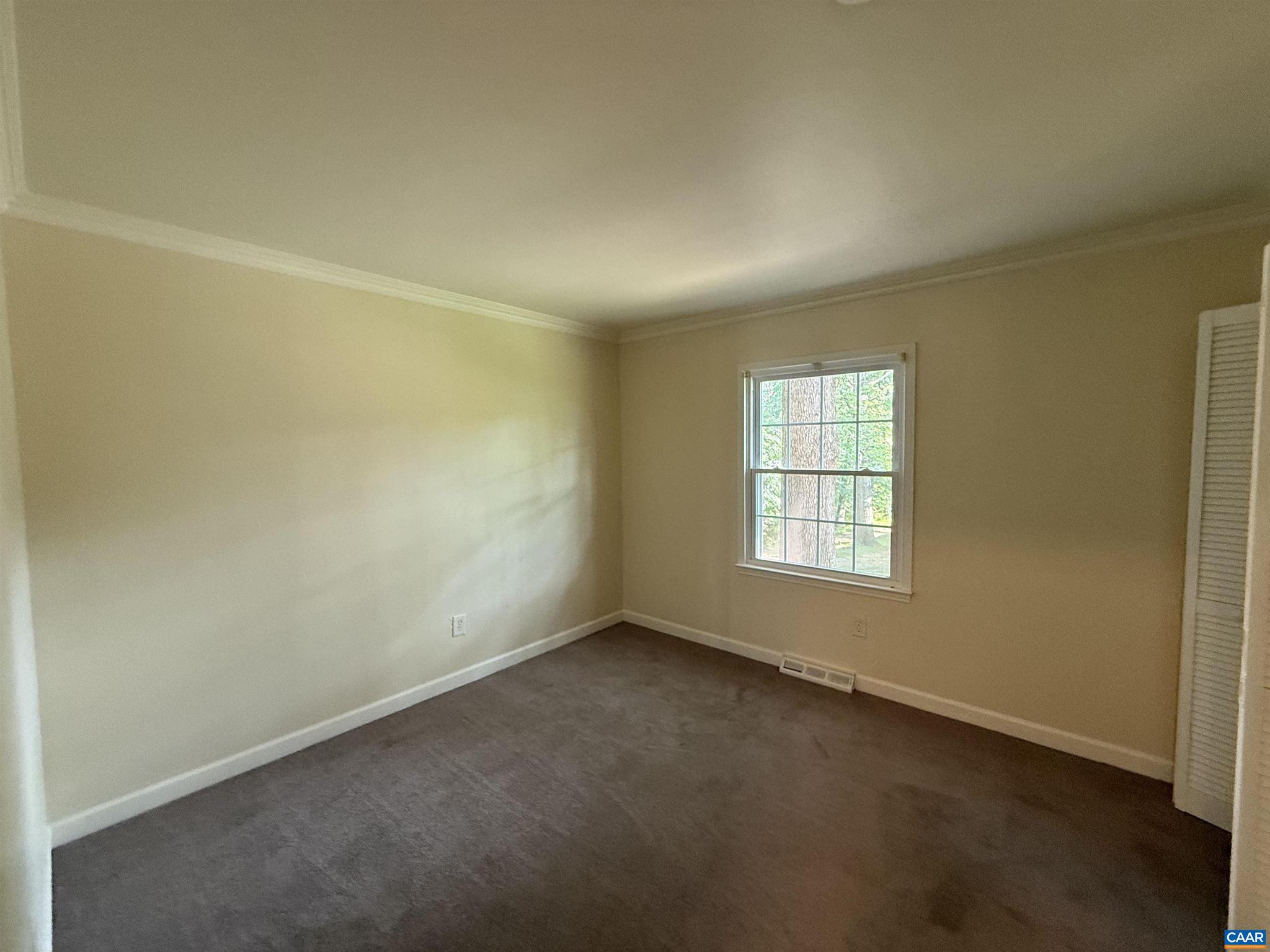 111 Hessian Hills Ridge, Unit 2 Charlottesville, VA 22901 - Photo 6 of 12 an empty room with a window