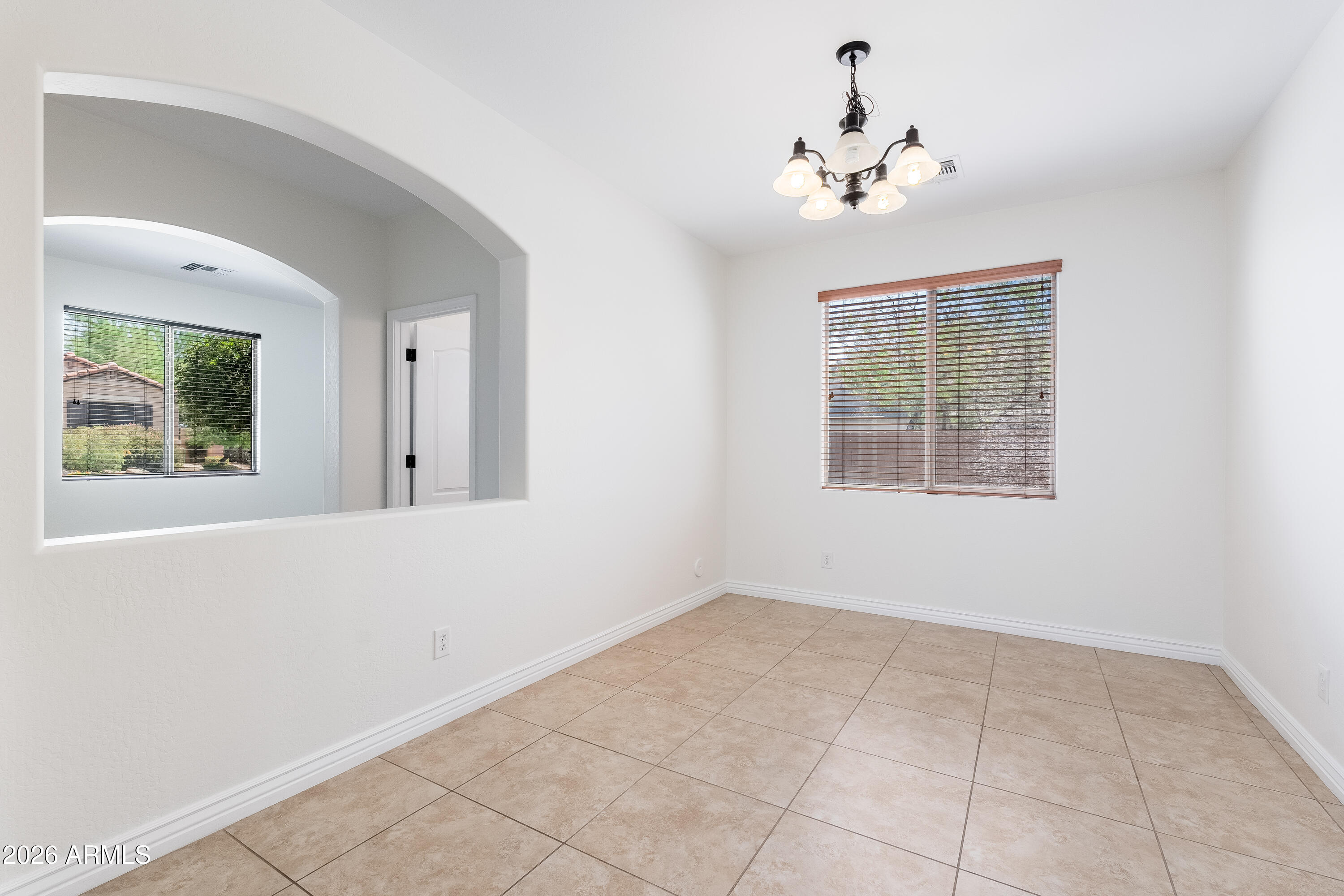 4317 East Folgers Road Phoenix, AZ 85050 - Photo 4 of 40 a view of an empty room with a window