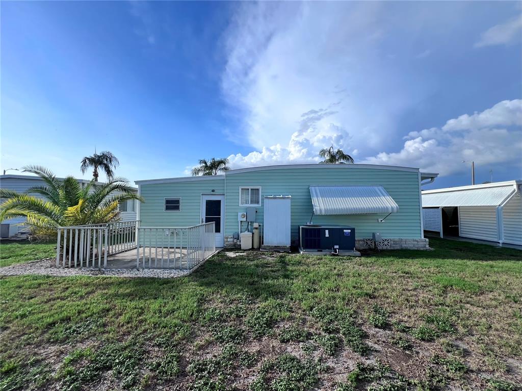 1100 South Belcher Road, Unit 772 Largo, FL 33771 - Photo 47 of 84 a view of a house with a yard and a porch