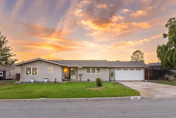 a view of a yard in front of a house with a yard