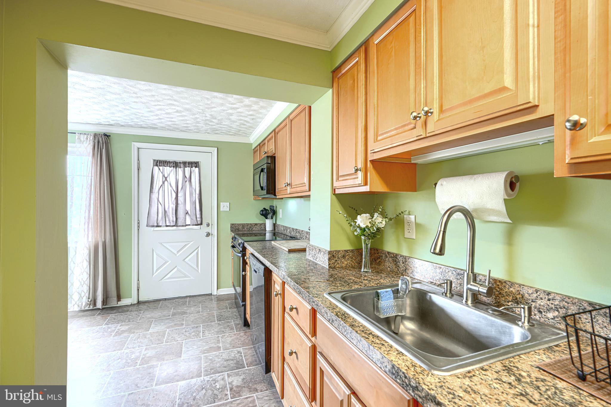 2829 Creston Road Baltimore, MD 21222 - Photo 13 of 44 Spacious Kitchen w/Door to Deck