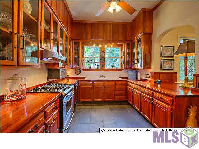 4150 Perkins Road Baton Rouge, LA 70808 - Photo 11 of 31 Mahogany Kitchen overlooks the far driveway area and guest house