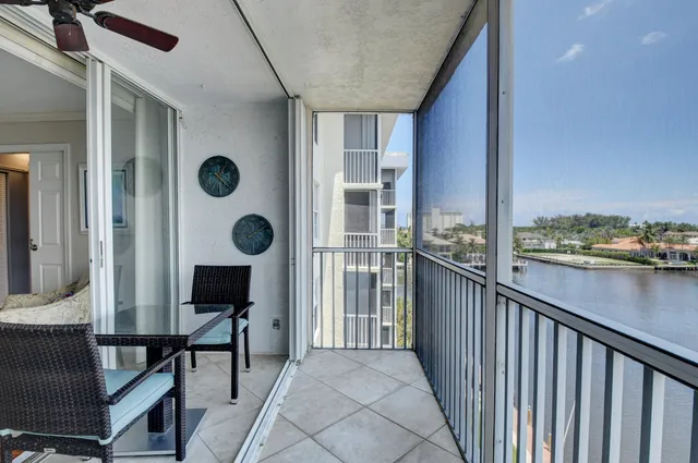a view of a balcony with furniture