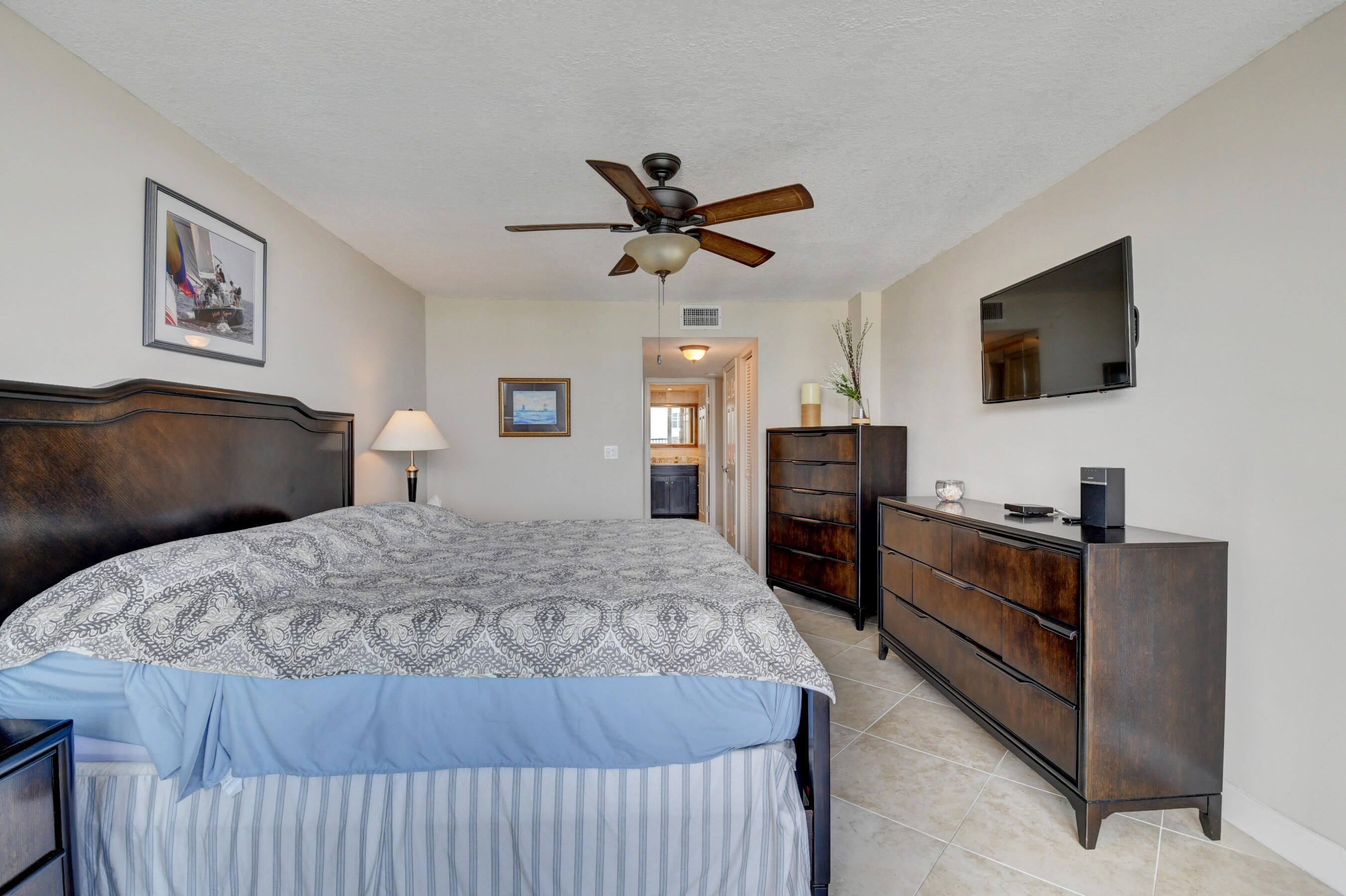 1 Harbourside Drive, Unit 3603 Delray Beach, FL 33483 - Photo 32 of 67 a bedroom with a bed and a flat screen tv