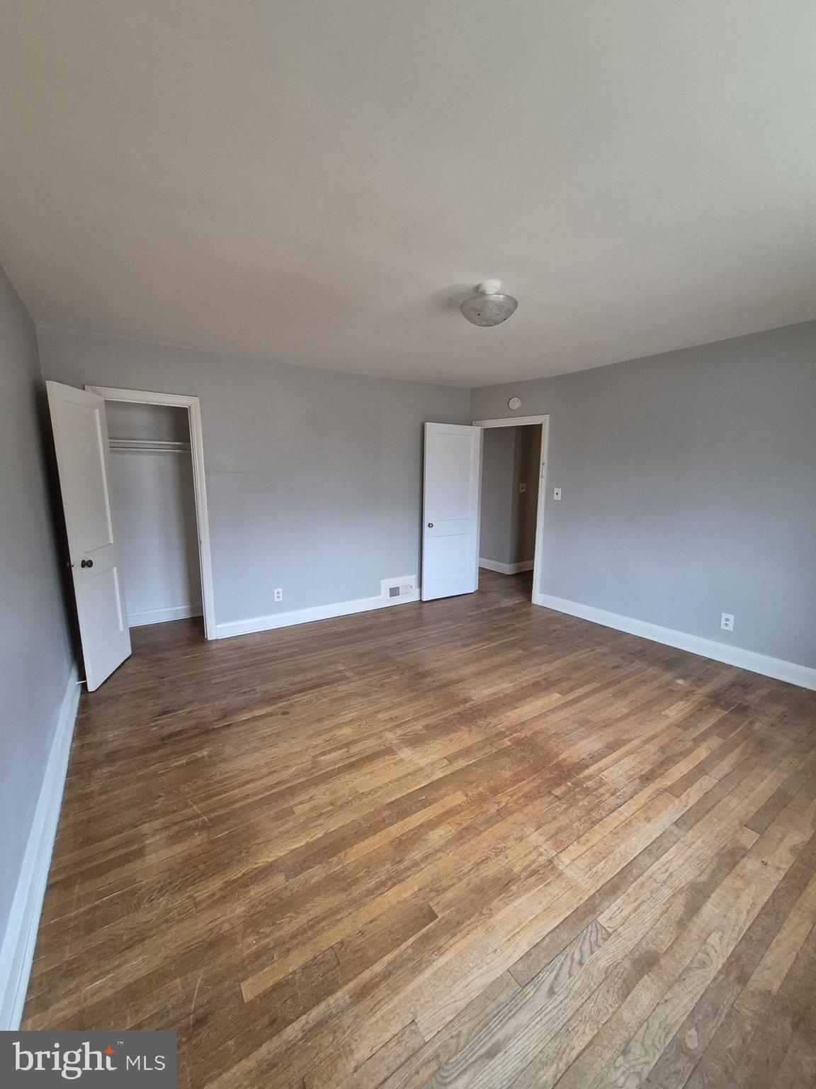 4905 Briarclift Road Baltimore, MD 21229 - Photo 15 of 41 a view of empty room with wooden floor