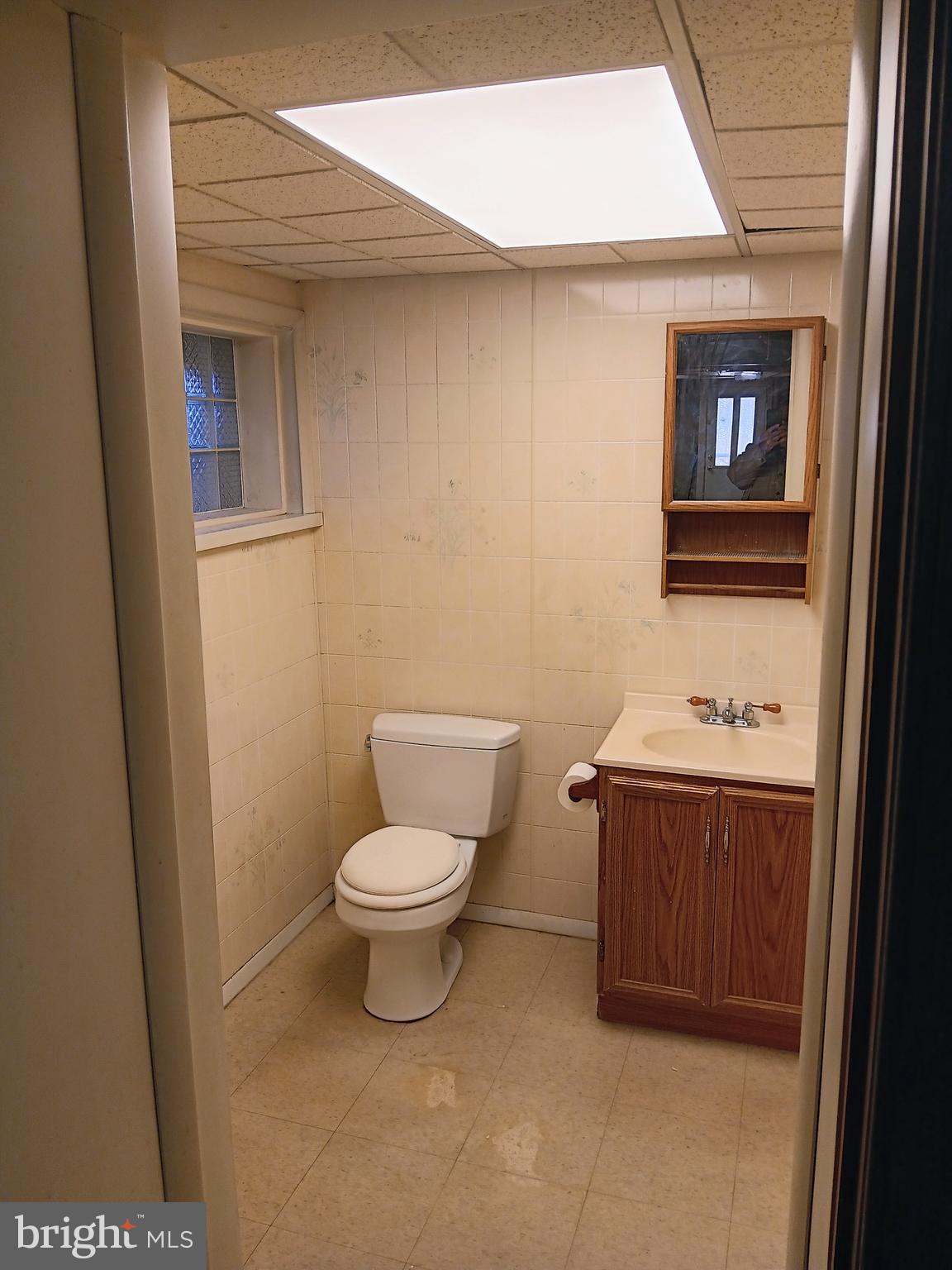 4905 Briarclift Road Baltimore, MD 21229 - Photo 39 of 41 a bathroom with a toilet and a sink