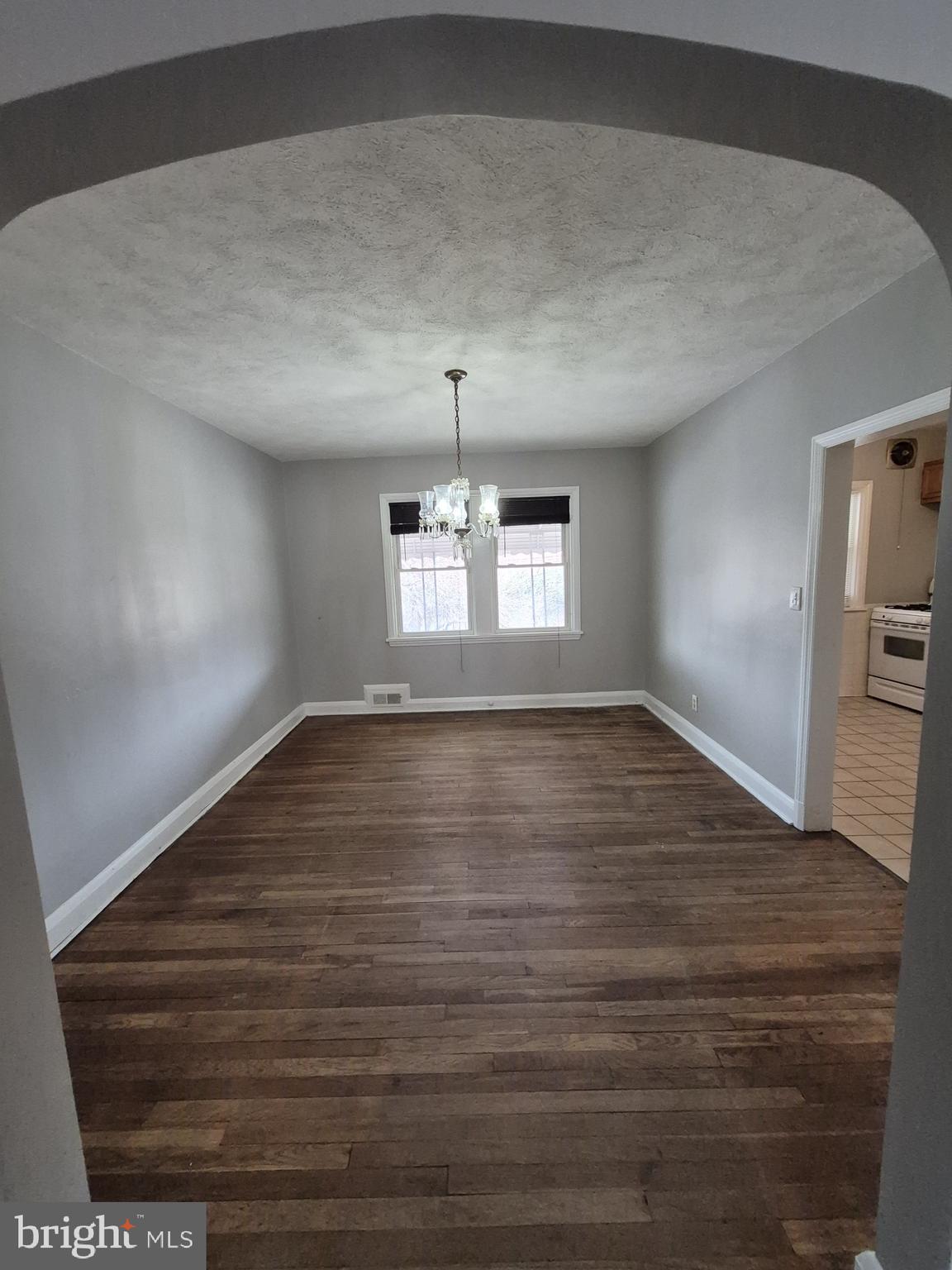 4905 Briarclift Road Baltimore, MD 21229 - Photo 8 of 41 a view of wooden floor and windows in a room