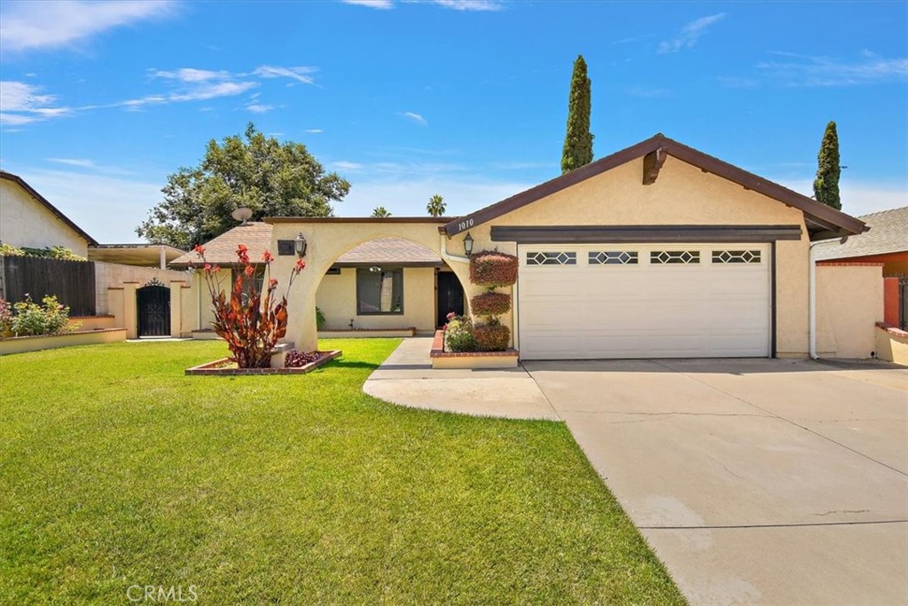 1010 Minerva Court Riverside, CA 92507 - Photo 1 of 1 a view of a house with yard and garage