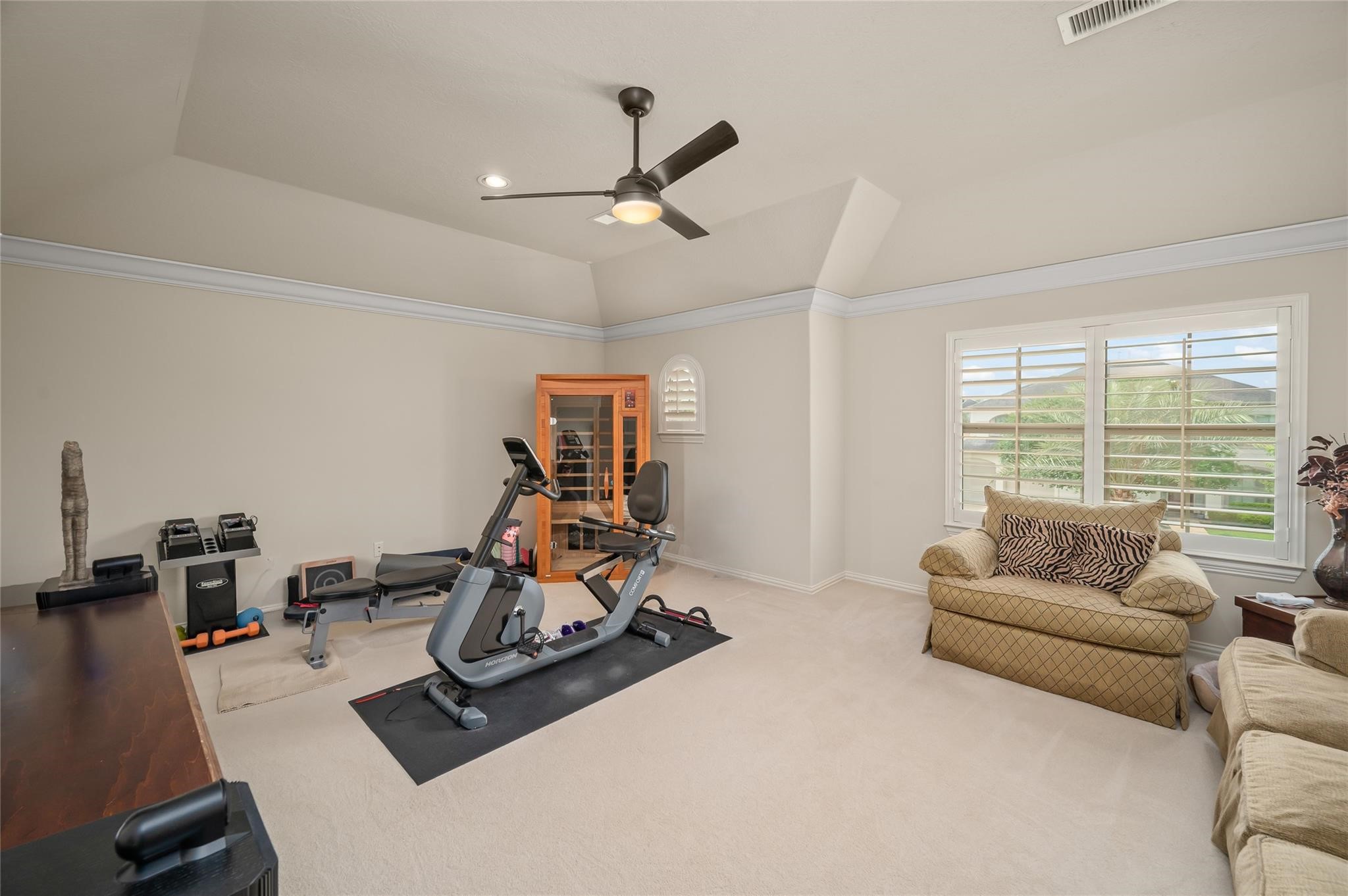 2127 Thicket Ridge Lane Houston, TX 77077 - Photo 31 of 50 The large upstairs bedroom/game room is currently being used as a in home workout area. The plantation shutters open up to the front yard and take note of the room being large enough to easily fit the workout equipment, sauna, desk, large chair and couch. The room can be used for a large number of things that fit your lifestyle.