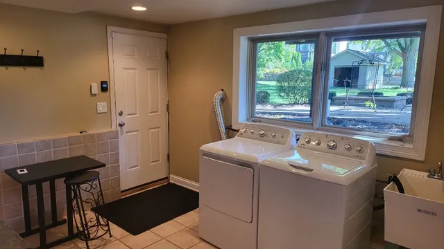 a utility room with dryer and washer