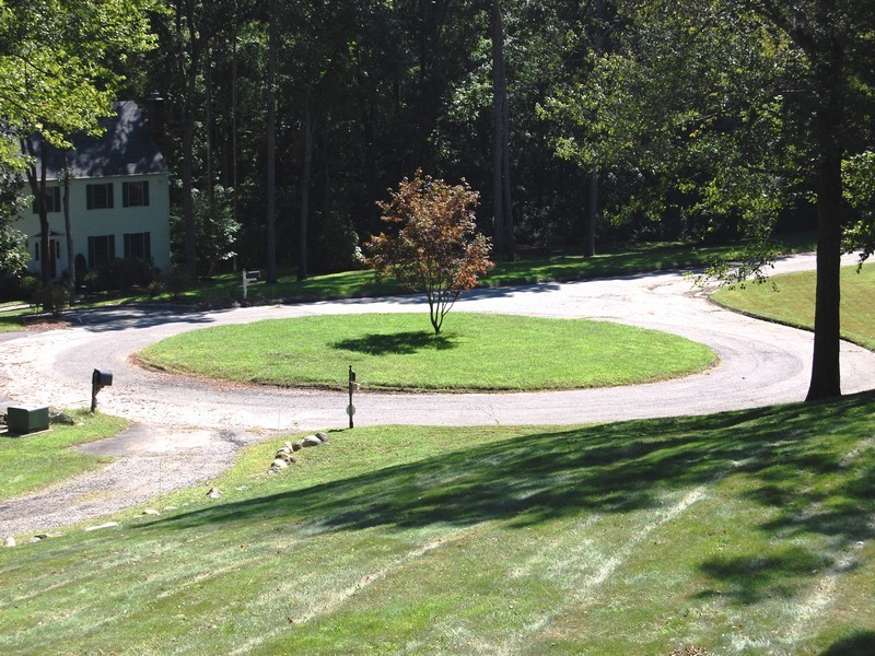 5 Cricklewood Road Redding, CT 06896 - Photo 15 of 16 a backyard of a house with lots of green space and fountain