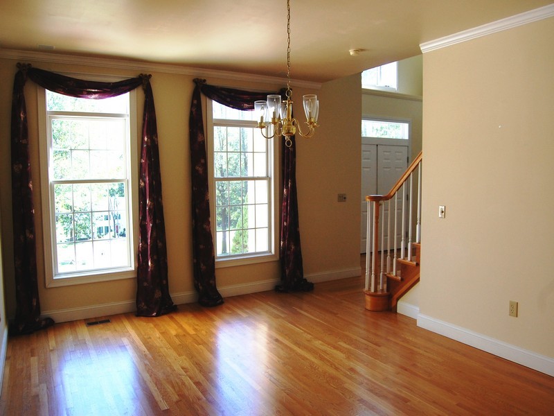 5 Cricklewood Road Redding, CT 06896 - Photo 4 of 16 an empty room with wooden floor and windows