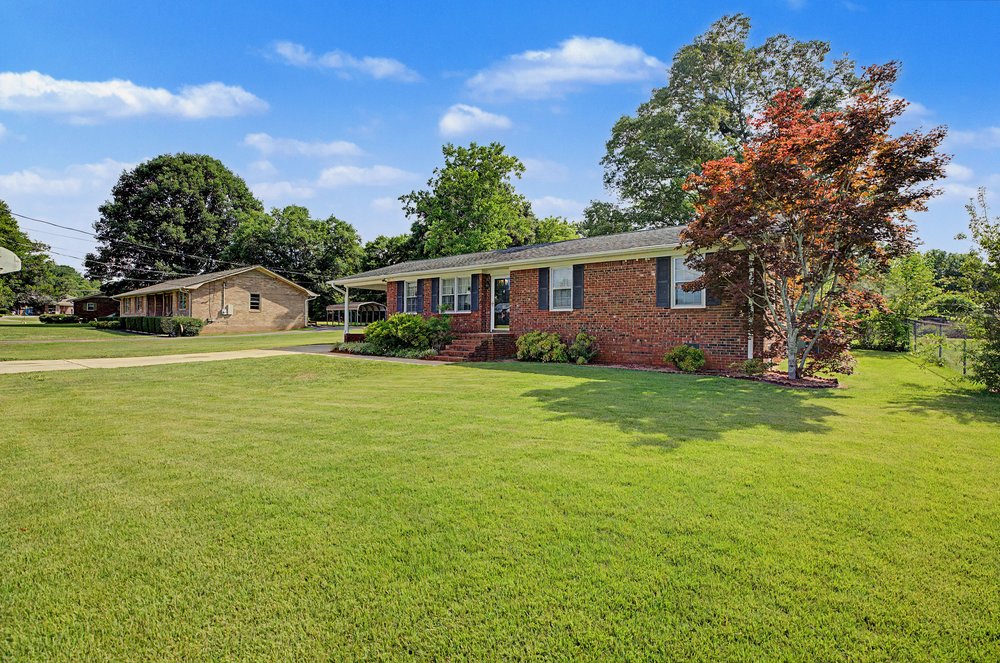 115 Brunson Drive Pickens, SC 29671 - Photo 2 of 29 Well-maintained brick home nestled on a generously sized, verdant lot.