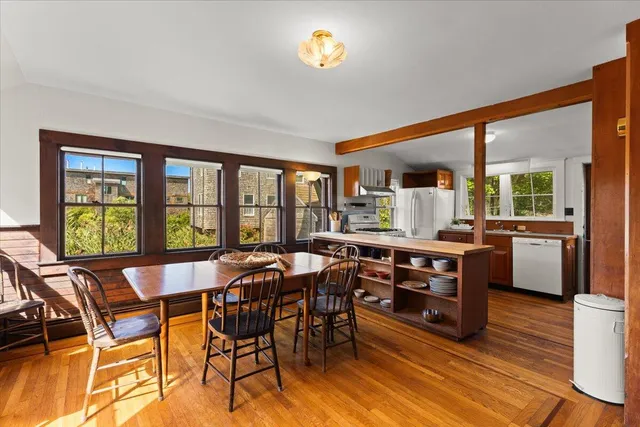 a view of a dining room with furniture and a window
