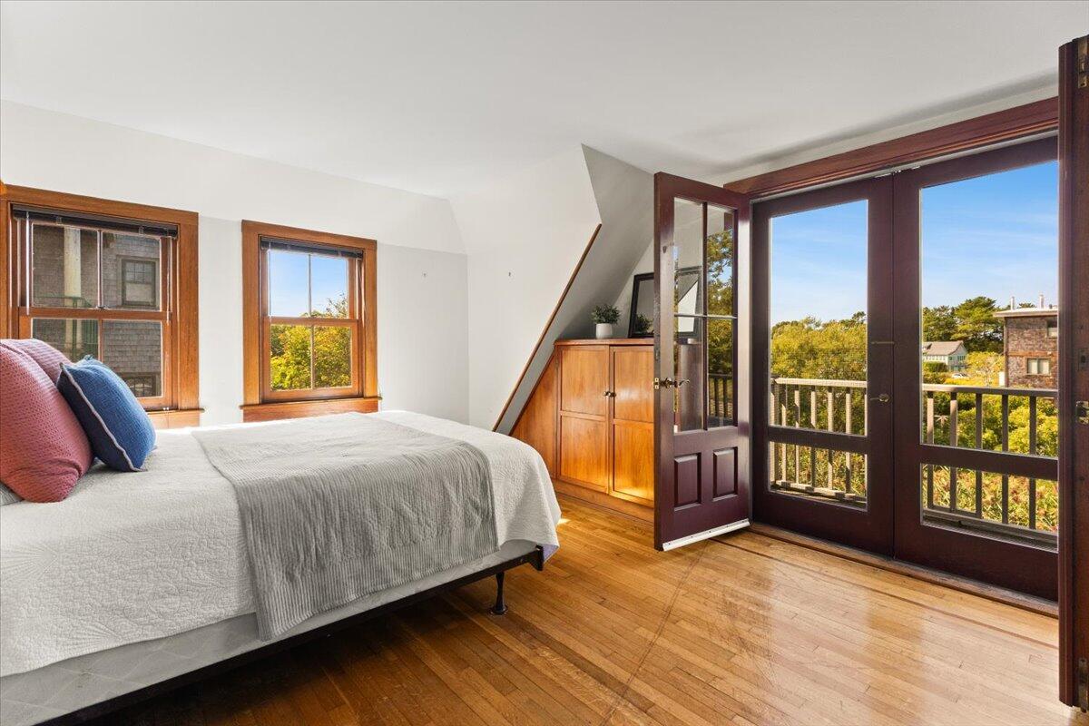5 Park Road Woods Hole, MA 02543 - Photo 19 of 45 a bedroom with a large bed and a large window