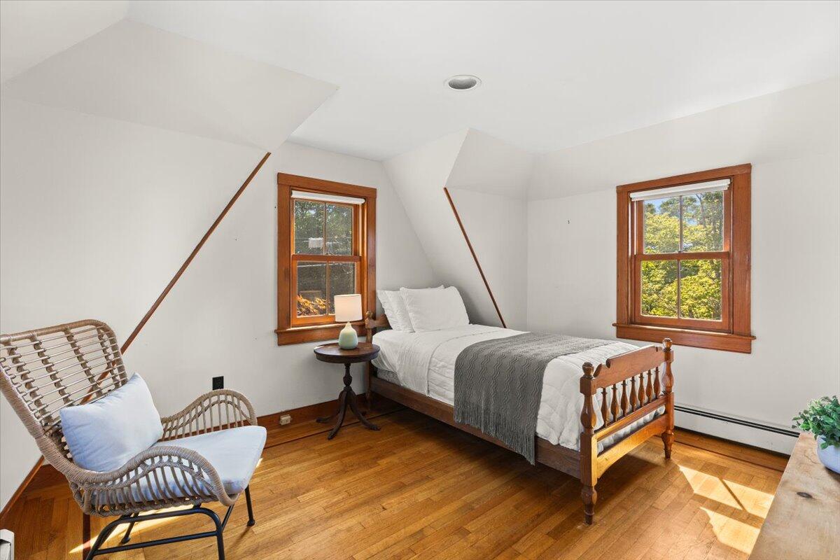 5 Park Road Woods Hole, MA 02543 - Photo 27 of 45 a bedroom with a bed window and chair