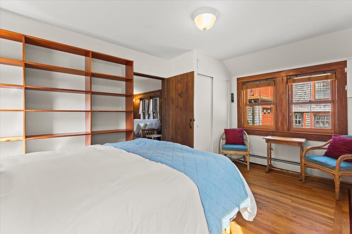 5 Park Road Woods Hole, MA 02543 - Photo 9 of 45 a bed room with a bed and a chair