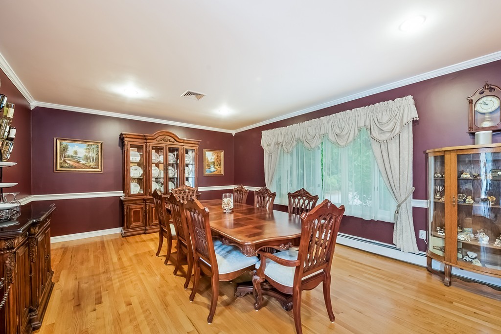 265 Andover Road Billerica, MA 01821 - Photo 8 of 30 a dining room with furniture window and wooden floor