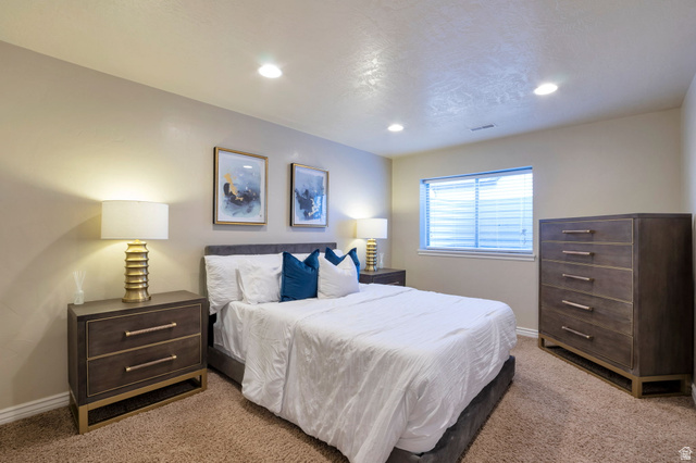 577 South Ridge Top Lane East North Salt Lake, UT 84054 - Photo 35 of 57 Additional lower-level bedroom offering comfort, privacy, and flexibility.