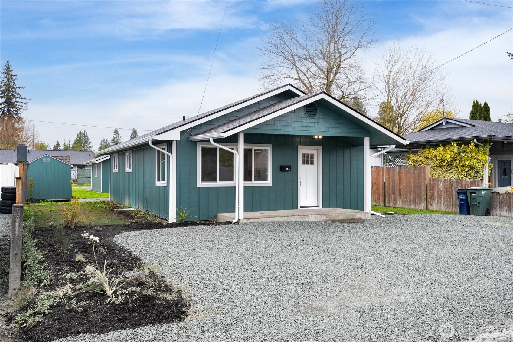944 Fidalgo Street Sedro-Woolley, WA 98284 - Photo 1 of 28 a front view of a house with a yard and garage