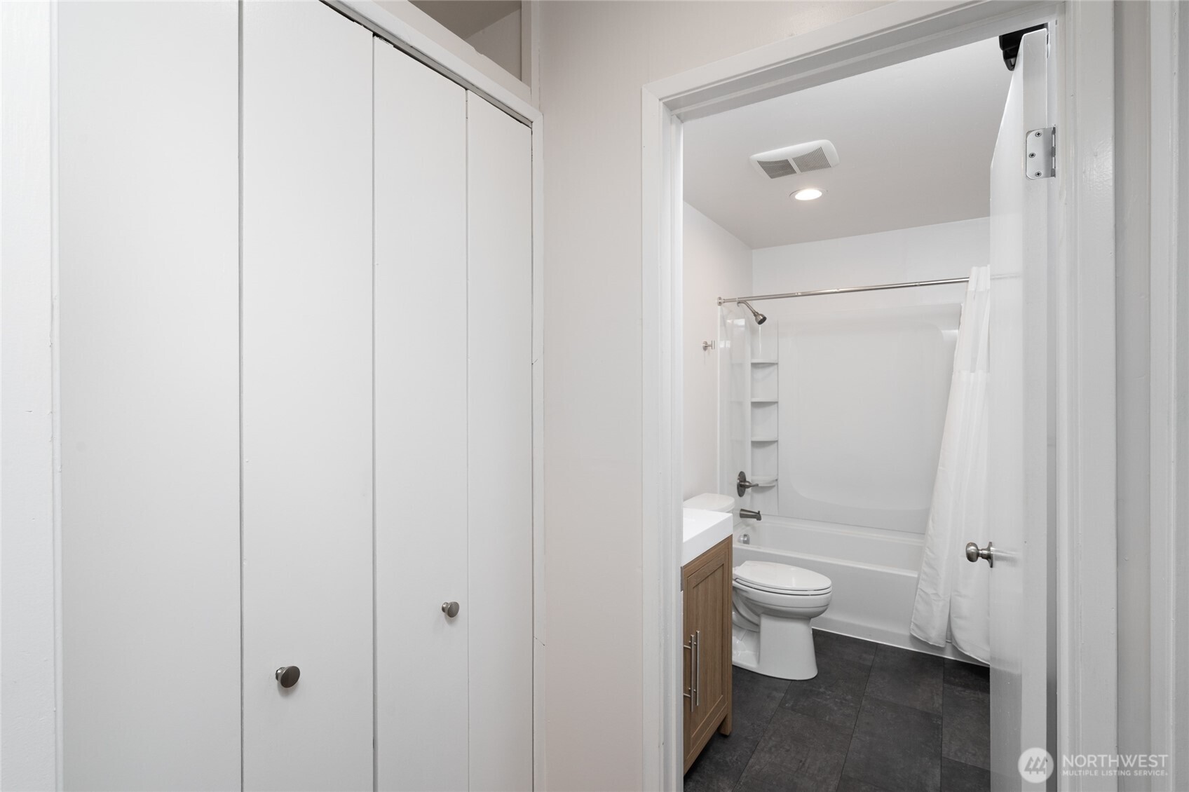 944 Fidalgo Street Sedro-Woolley, WA 98284 - Photo 11 of 28 a bathroom with a toilet a sink and shower