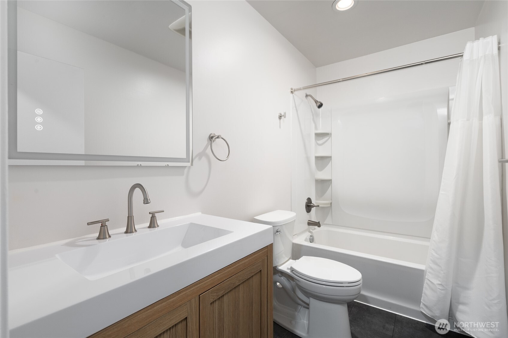 944 Fidalgo Street Sedro-Woolley, WA 98284 - Photo 12 of 28 a bathroom with a sink toilet and shower