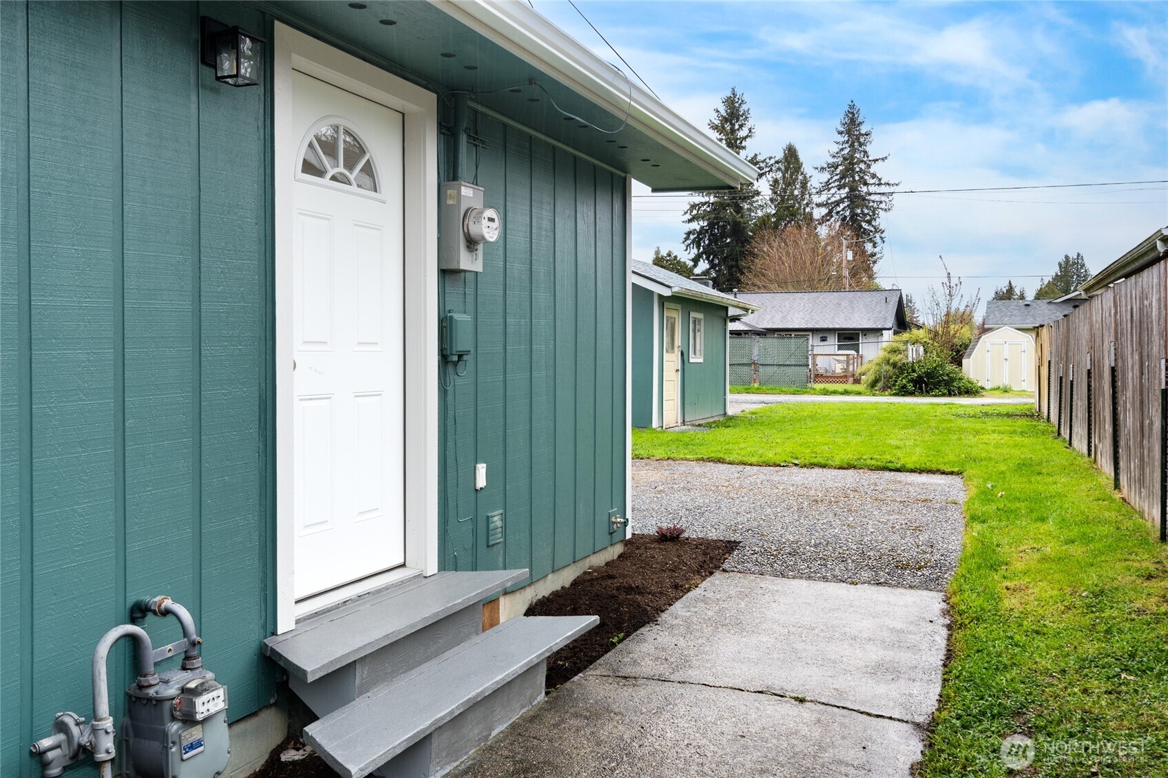 944 Fidalgo Street Sedro-Woolley, WA 98284 - Photo 16 of 28 a house with garden in front of it