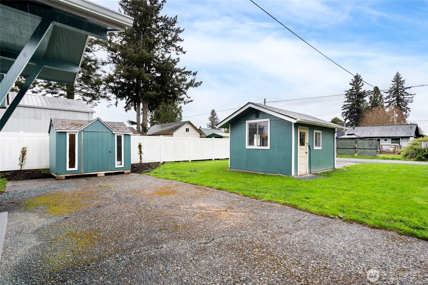 944 Fidalgo Street Sedro-Woolley, WA 98284 - Photo 20 of 28 a view of a yard in front of a house with a large tree