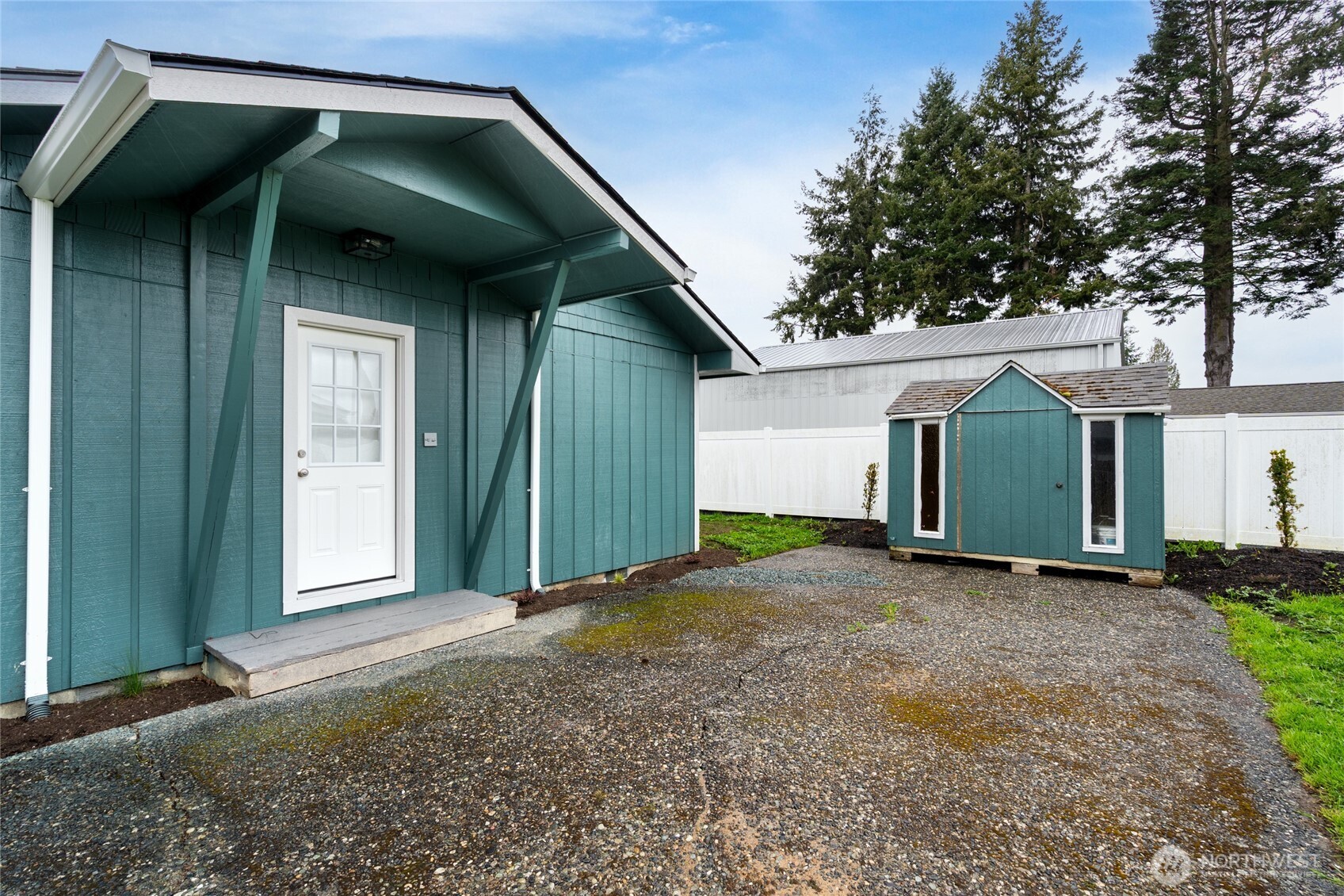 944 Fidalgo Street Sedro-Woolley, WA 98284 - Photo 21 of 28 a view of a house with backyard and trees