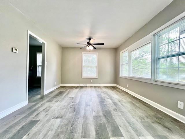 511 Emily Place Northwest Atlanta, GA 30318 - Photo 4 of 11 wooden floor in an empty room with a window