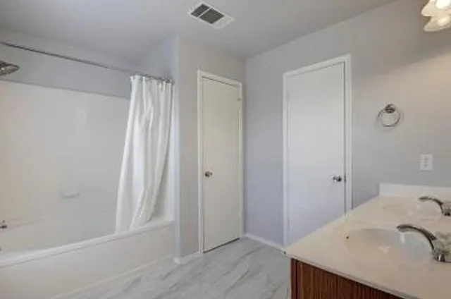 a bathroom with a sink and a tub
