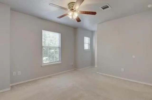 a view of an empty room with a window