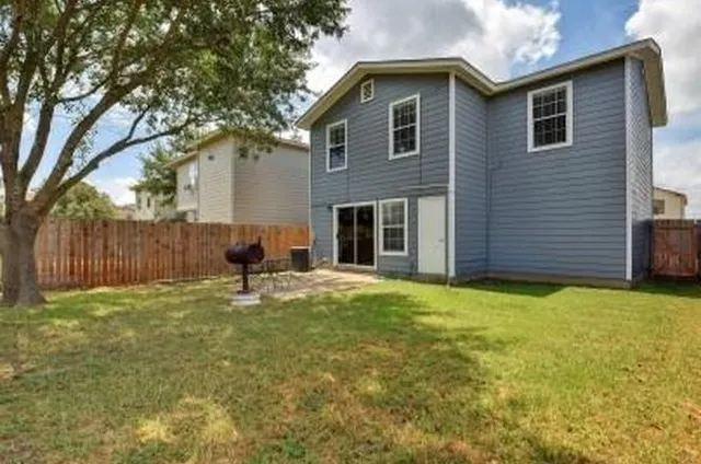 a backyard of a house with seating space