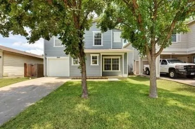 a house view with a garden space