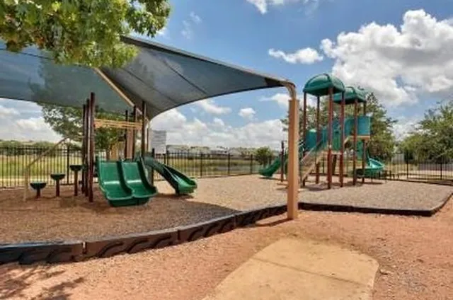 a view of a park with slide