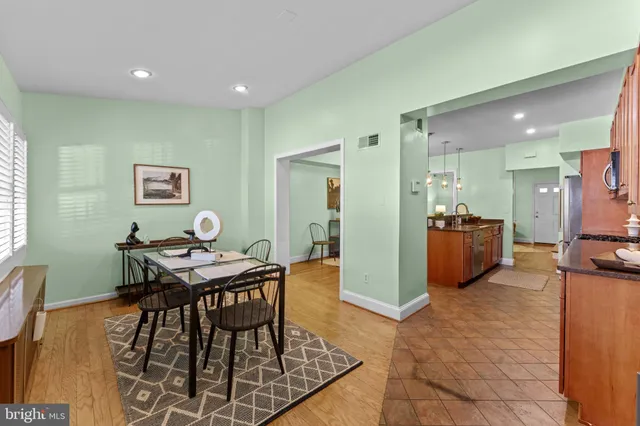 a dining room with furniture and windows