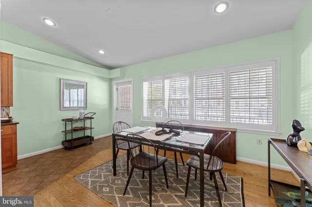 a bathroom with a toilet a sink and a mirror