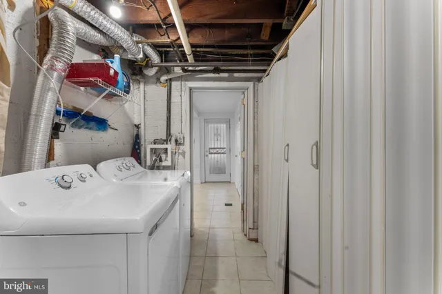 a view of a patio with table and chairs