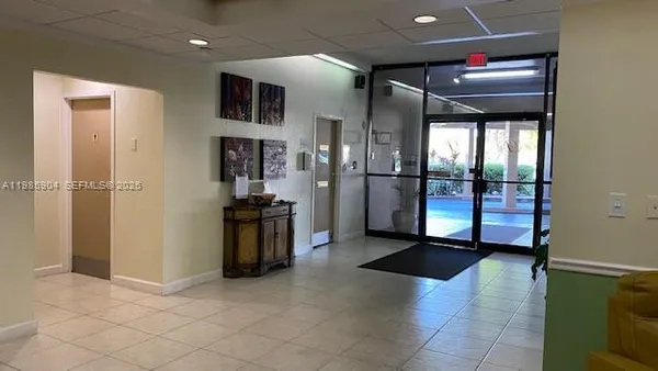 a view of a hallway with a living room