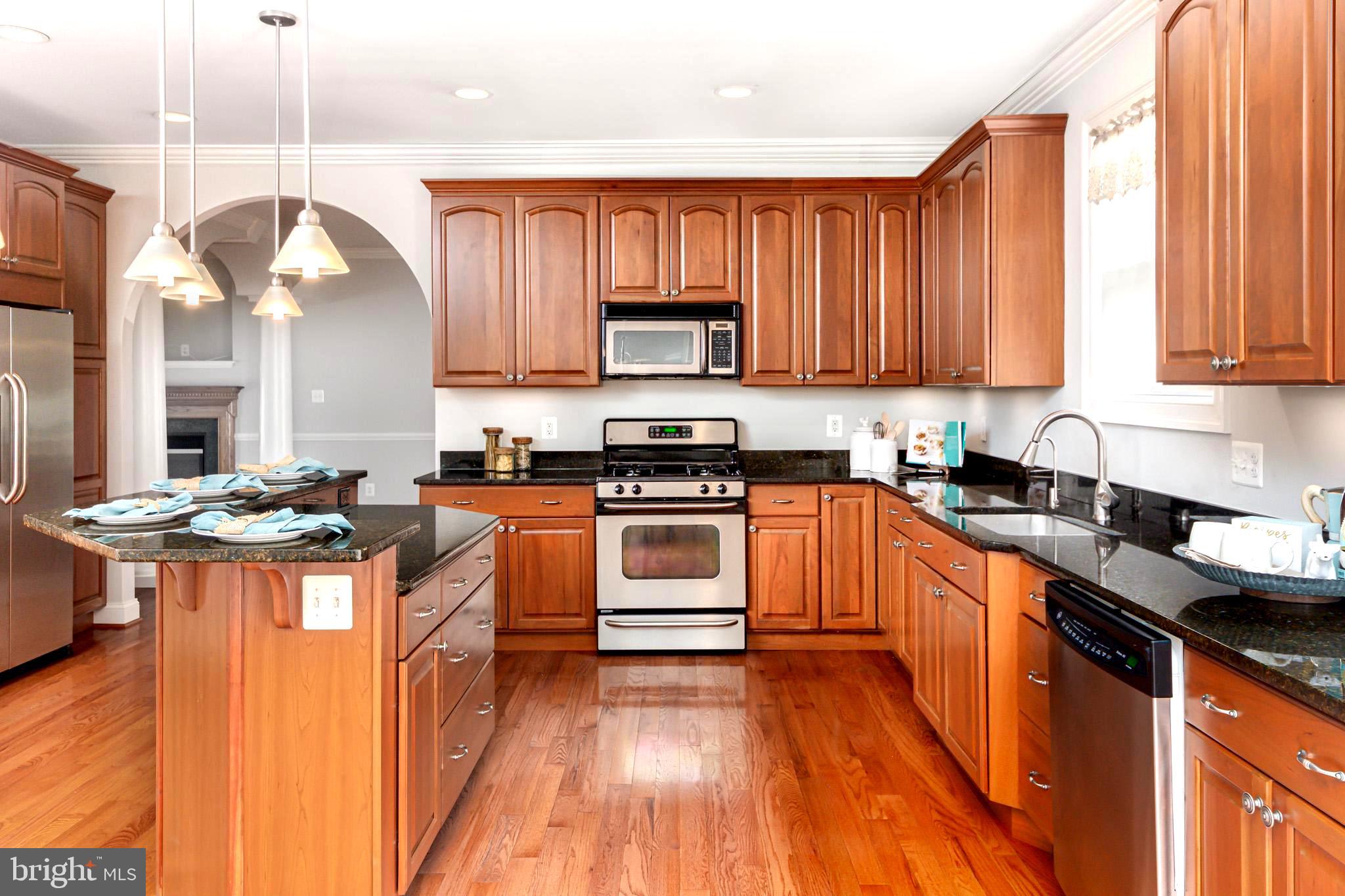 3965 Patuxent River Road Davidsonville, MD 21035 - Photo 17 of 66 Chic granite with cherry cabinetry