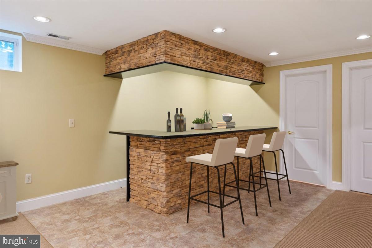 3965 Patuxent River Road Davidsonville, MD 21035 - Photo 56 of 66 Stone wet bar with fridge