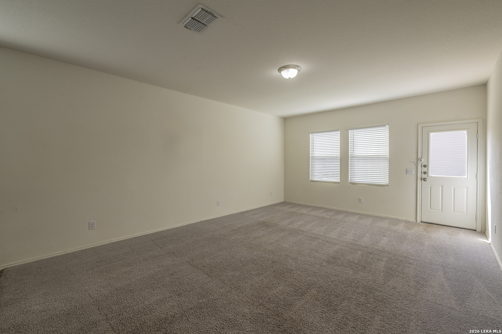5203 Winding Streme St. Hedwig, TX 78152 - Photo 5 of 26 an empty room with windows