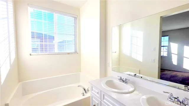 a white toilet sitting next to a shower