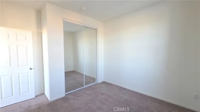 a white toilet sitting next to a white sink