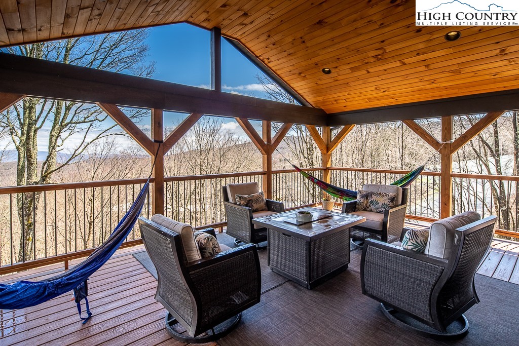 102 Ski Beech Road Beech Mountain, NC 28604 - Photo 18 of 40 a sitting area with furniture on wooden deck