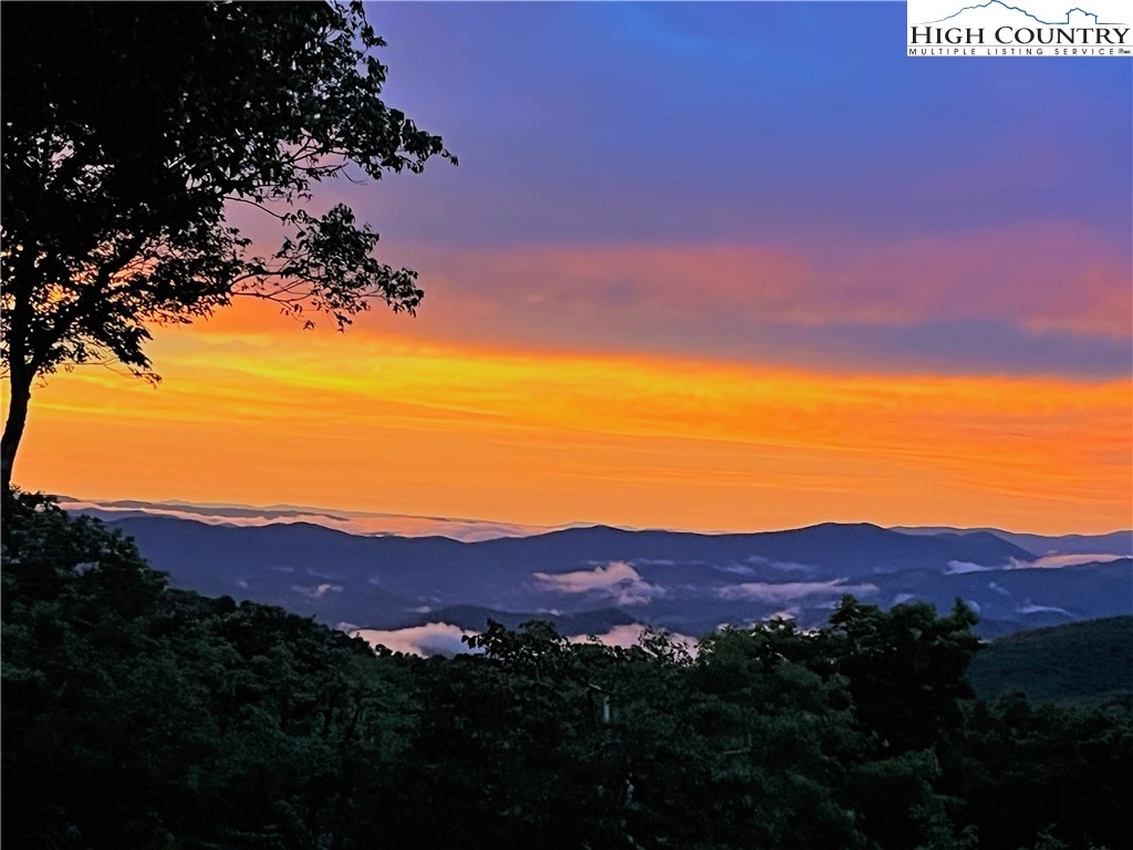 102 Ski Beech Road Beech Mountain, NC 28604 - Photo 2 of 40 a view of a house with a mountain in the background